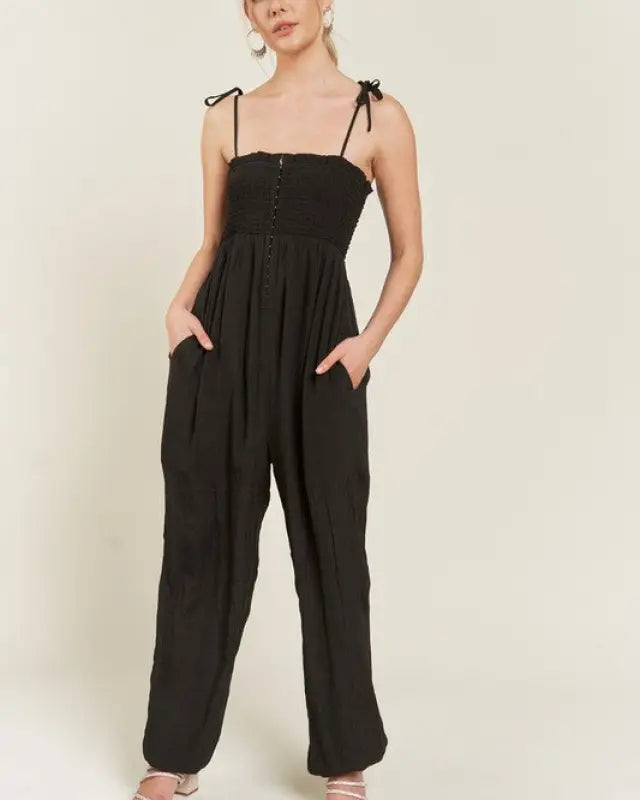 SMOCKED TIE STRAP JUMPSUIT