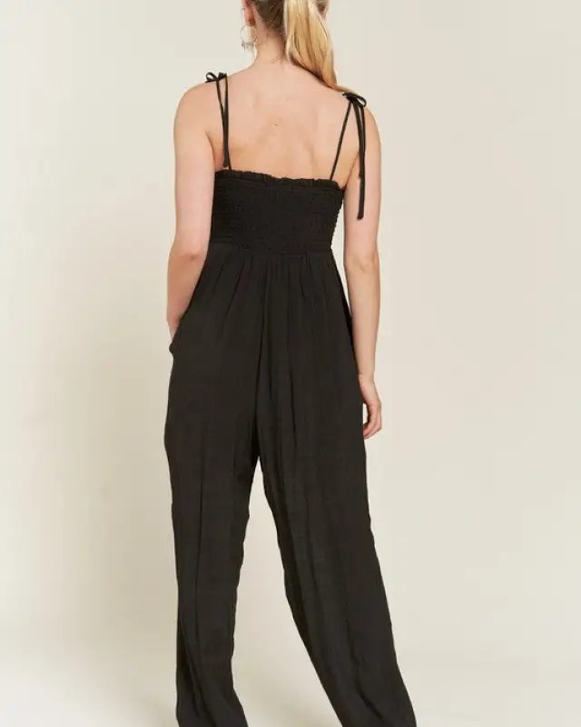 SMOCKED TIE STRAP JUMPSUIT